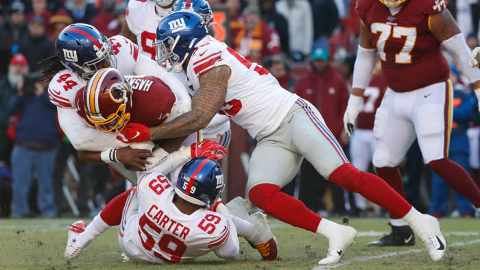 Redskins quarterback Dwayne Haskins is sacked during Sunday's game against the New York Giants.
